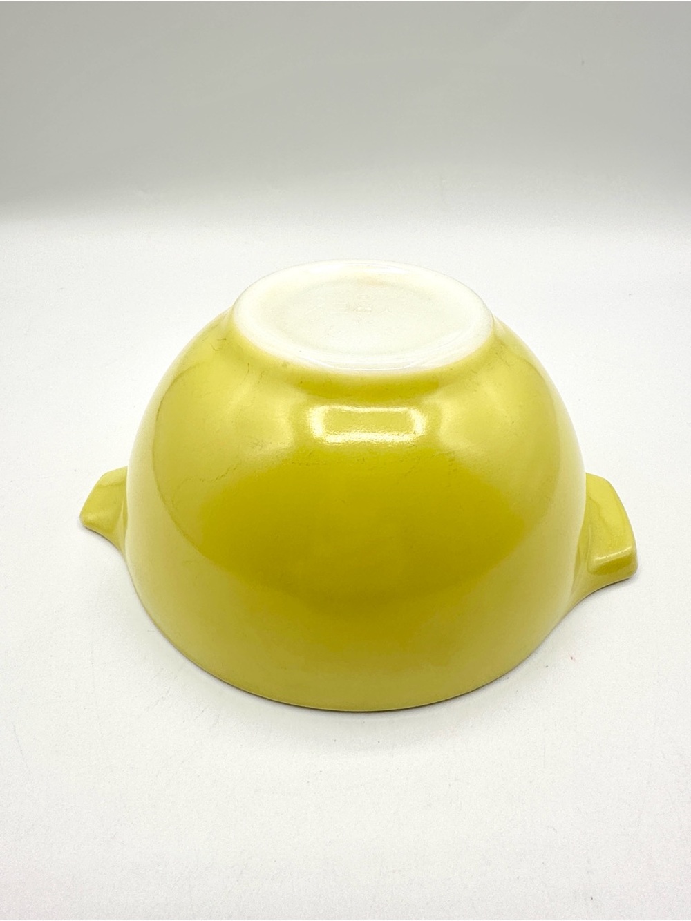 Pyrex Cinderella Yellow Bowl, with a handle and spout. Vintage 1960s.
